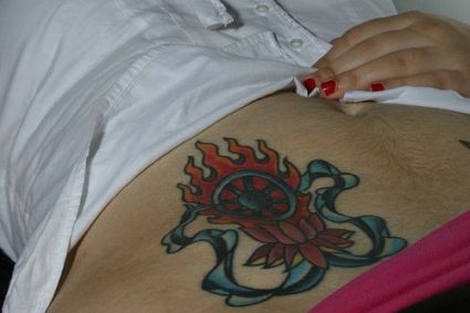 Flowers Tattoo On Girl's Stomach